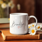 Brooklyn Heart 11 oz white mug with script Brooklyn lettering and a red heart